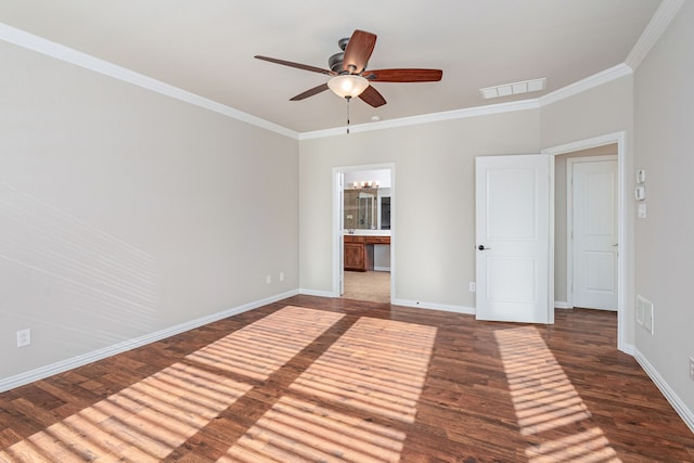 unfurnished bedroom with ornamental molding, wood finished floors, visible vents, and baseboards