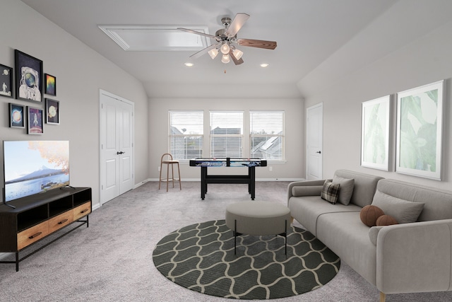 carpeted living area with a ceiling fan, lofted ceiling, baseboards, and recessed lighting