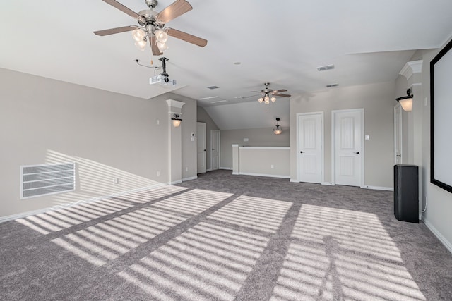 unfurnished living room featuring carpet, baseboards, visible vents, and vaulted ceiling