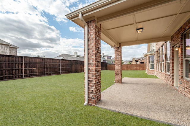 view of yard with a patio area and a fenced backyard