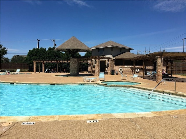 pool with a patio area, fence, a hot tub, and a pergola