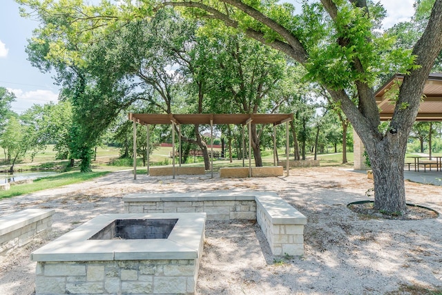 view of patio / terrace featuring an outdoor fire pit