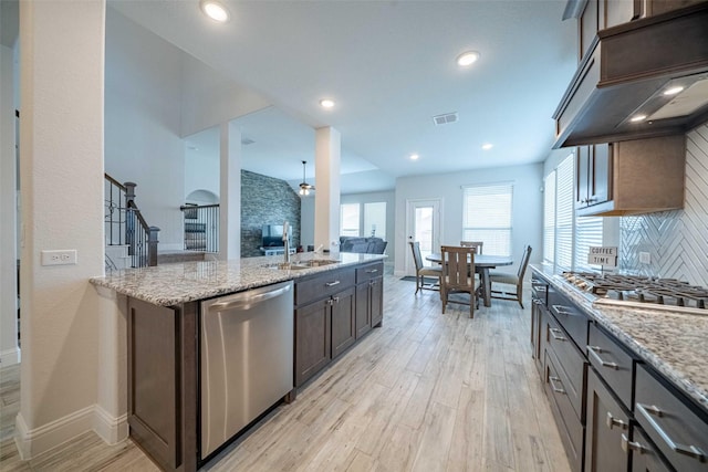 4130 Lagoon Pl, Royse City, TX 75189 - kitchen featuring stainless steel appliances, light wood finished floors, baseboards, tasteful backsplash, and recessed lighting