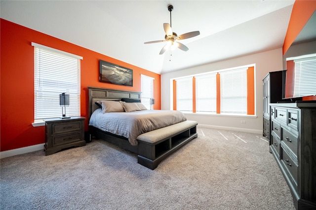 bedroom with ceiling fan, baseboards, carpet, and lofted ceiling