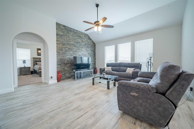 4130 Lagoon Pl, Royse City, TX 75189 - living room featuring a fireplace, lofted ceiling, healthy amount of natural light, ceiling fan, and light wood finished floors