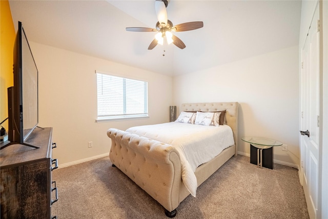 carpeted bedroom with ceiling fan and baseboards