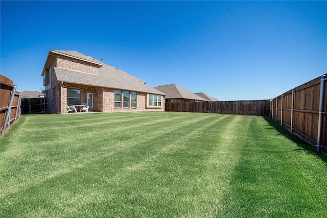 view of yard featuring a fenced backyard