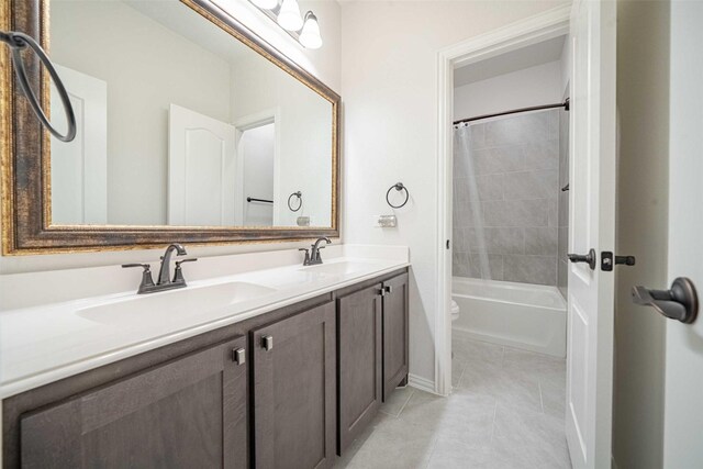 4130 Lagoon Pl, Royse City, TX 75189 - full bathroom with baseboards, double vanity, tile patterned floors, toilet, and shower / bathtub combination with curtain