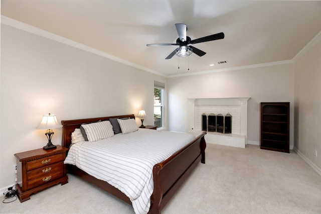 bedroom featuring ceiling fan, light colored carpet, a fireplace, baseboards, and crown molding