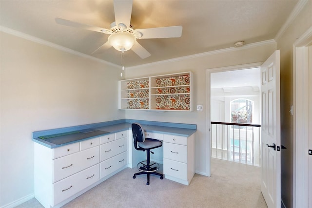 home office with ceiling fan, ornamental molding, and light colored carpet