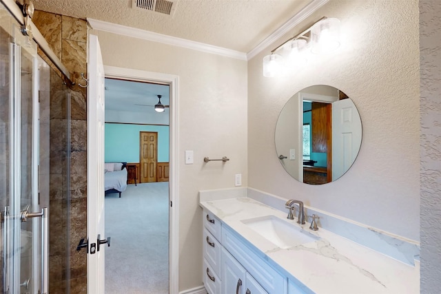 bathroom featuring visible vents, ornamental molding, connected bathroom, a textured ceiling, and vanity