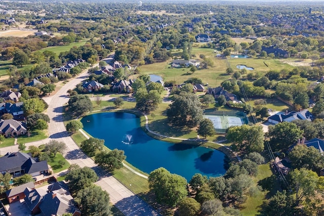 drone / aerial view featuring a water view and a residential view