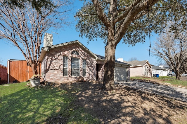 ranch-style house featuring a garage, driveway, a chimney, and a front lawn