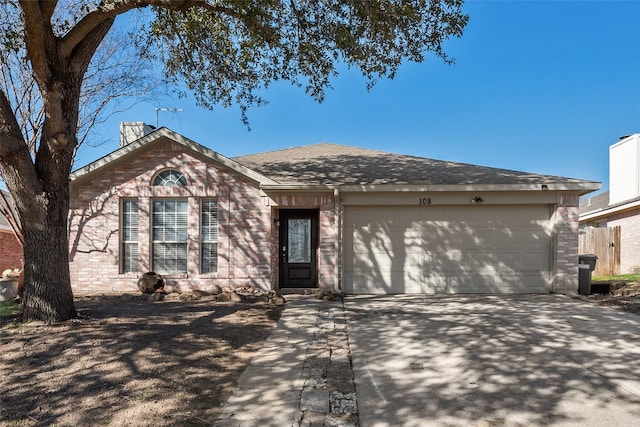 ranch-style house with an attached garage, driveway, and brick siding