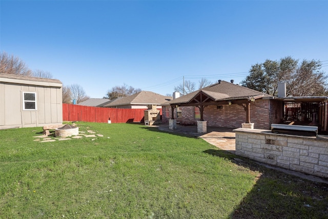 view of yard featuring fence and a patio