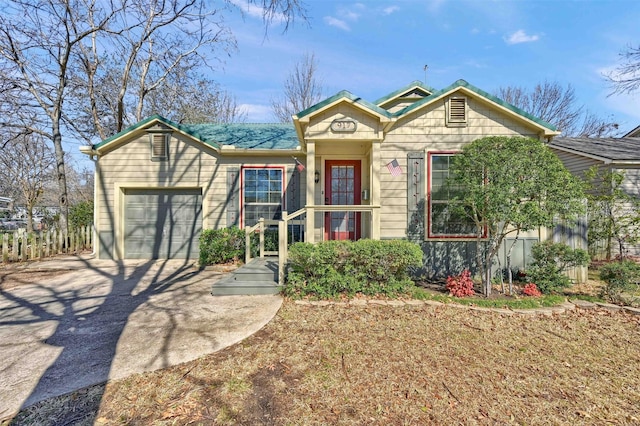 view of front of home with driveway and an attached garage