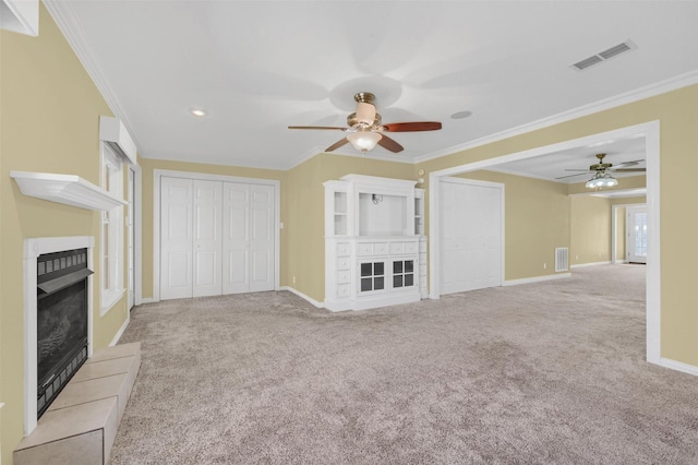 unfurnished living room with a fireplace with flush hearth, visible vents, crown molding, and carpet flooring