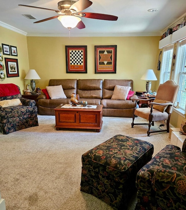 carpeted living room with ceiling fan, ornamental molding, and visible vents