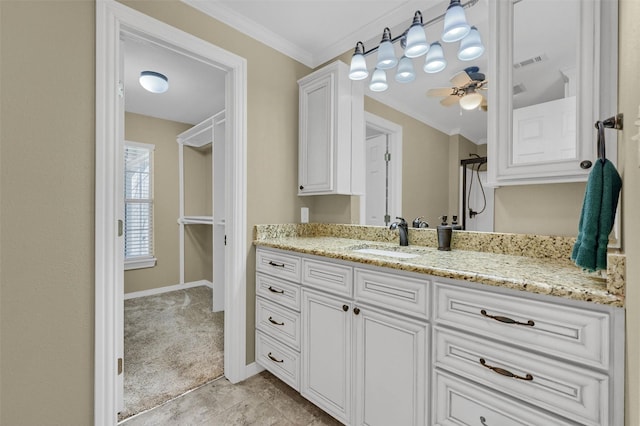 full bath featuring vanity, baseboards, visible vents, a shower, and crown molding