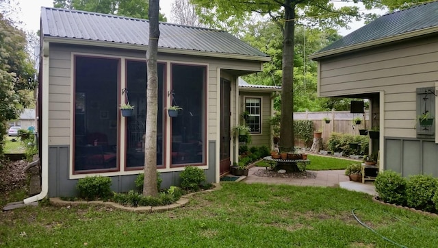 view of outdoor structure with fence