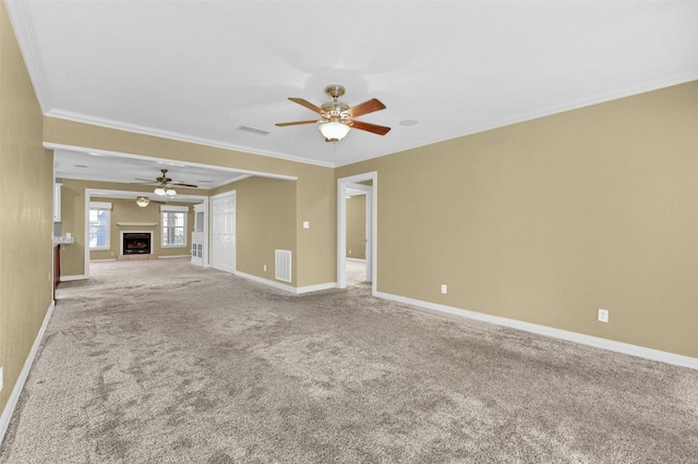 unfurnished living room featuring carpet, a fireplace, visible vents, and baseboards