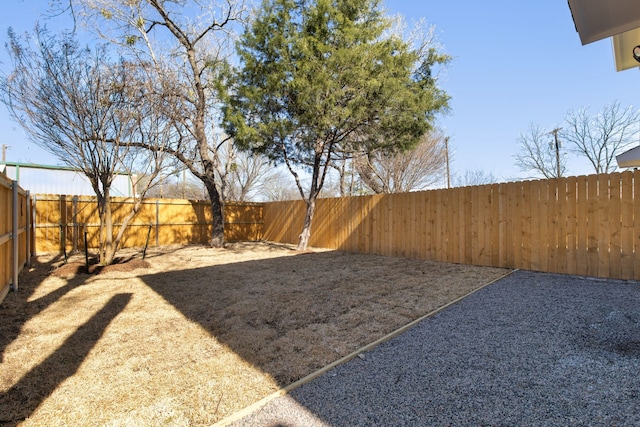 view of yard with a fenced backyard