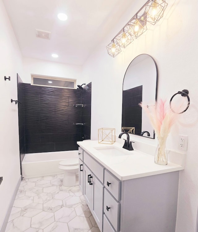 bathroom featuring visible vents, toilet, marble finish floor, shower / bath combination, and vanity