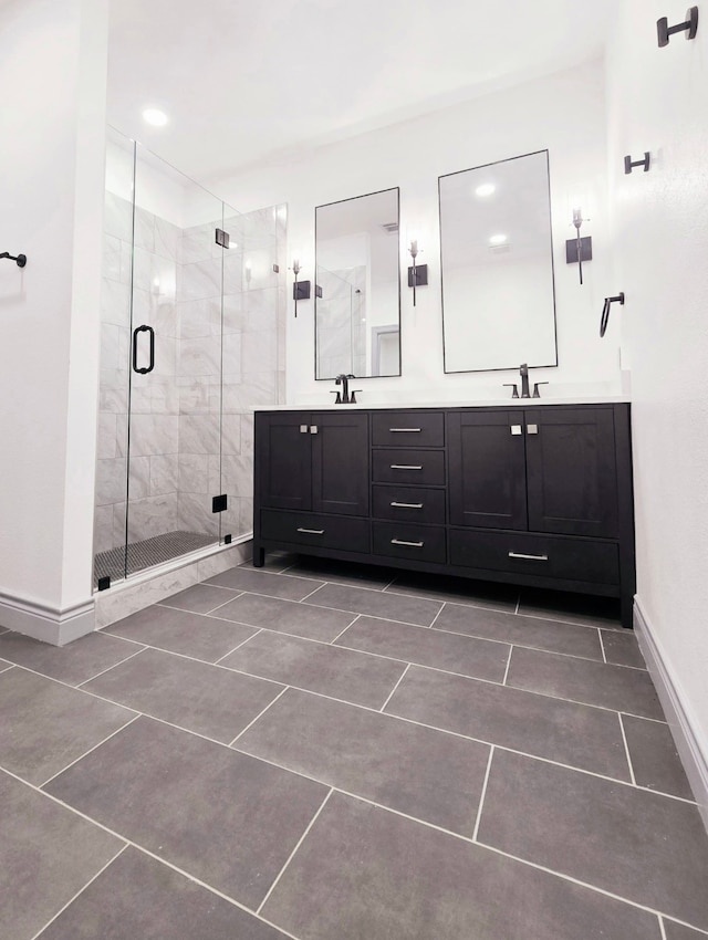5147 Chapman St, Fort Worth, TX 76105 - bathroom featuring a stall shower, double vanity, baseboards, and tile patterned flooring