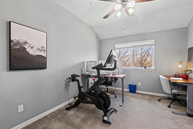 exercise area featuring carpet floors, lofted ceiling, baseboards, and a ceiling fan