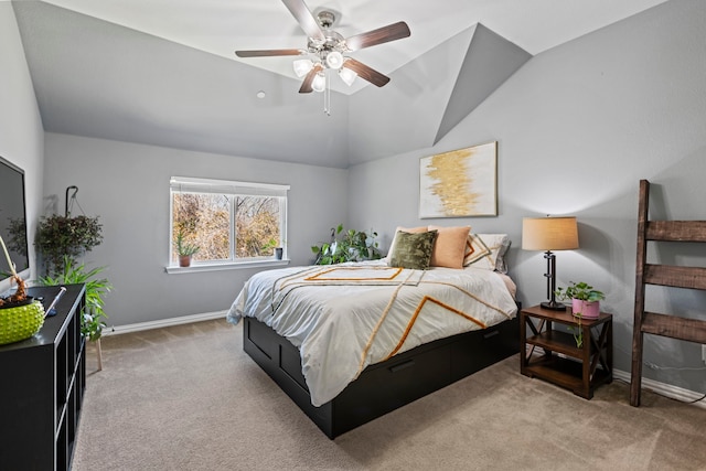 bedroom with carpet floors, baseboards, vaulted ceiling, and a ceiling fan