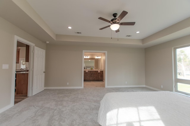 unfurnished bedroom featuring light colored carpet, visible vents, baseboards, and recessed lighting