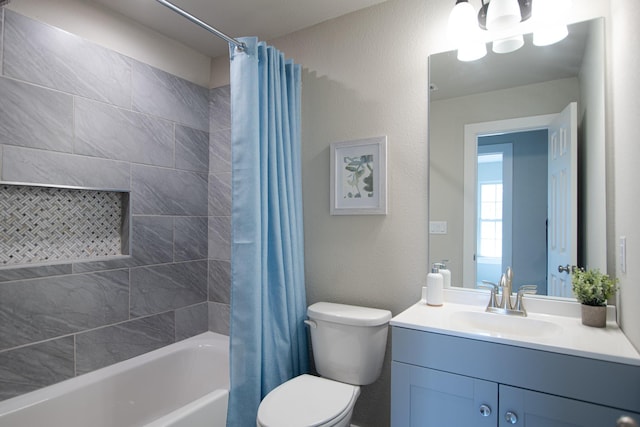 bathroom with a textured wall, vanity, shower / bath combo with shower curtain, and toilet