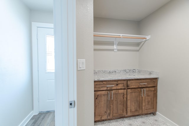 laundry room featuring baseboards