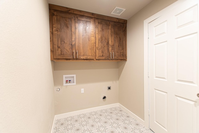 laundry room with hookup for an electric dryer, washer hookup, visible vents, baseboards, and cabinet space