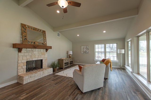 living area featuring vaulted ceiling with beams, dark wood-style floors, and visible vents