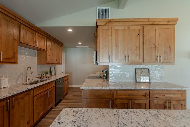 kitchen with visible vents, lofted ceiling, light stone counters, a sink, and stainless steel dishwasher