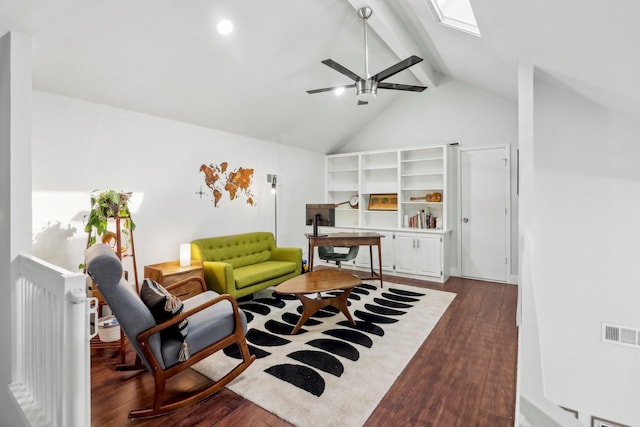 living area with dark wood-style floors, a skylight, beam ceiling, and visible vents