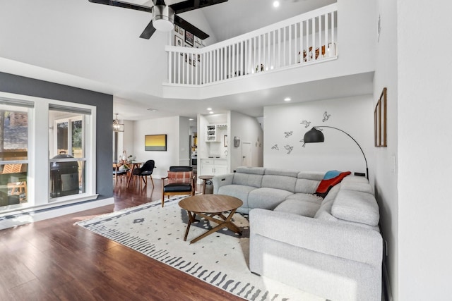 living room with ceiling fan and wood finished floors