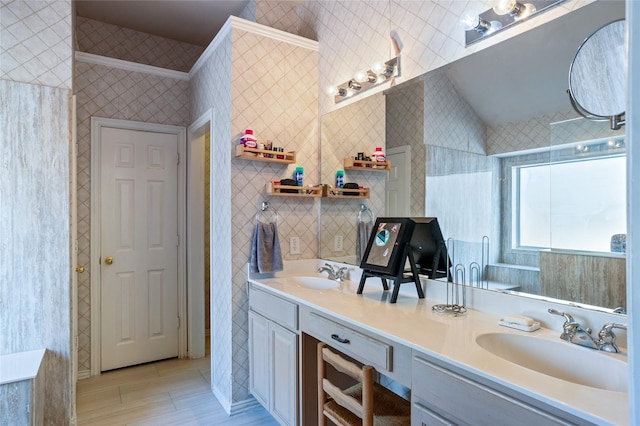 full bath featuring double vanity, tile walls, and a sink