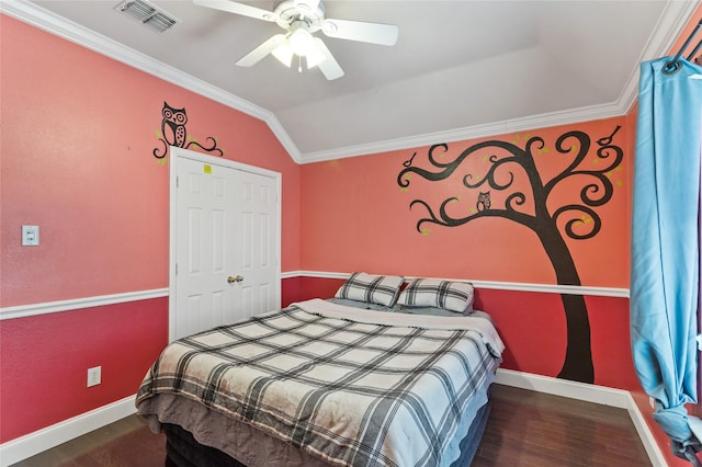 bedroom featuring visible vents, baseboards, wood finished floors, and vaulted ceiling