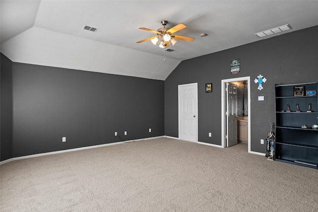 bonus room featuring visible vents, carpet, and vaulted ceiling