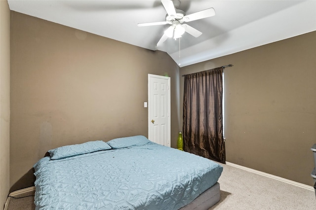 carpeted bedroom featuring vaulted ceiling, baseboards, and ceiling fan