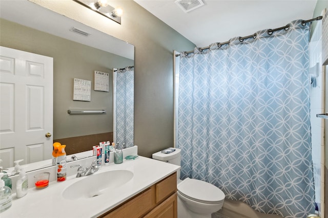 bathroom with visible vents, toilet, shower / bath combo, and vanity