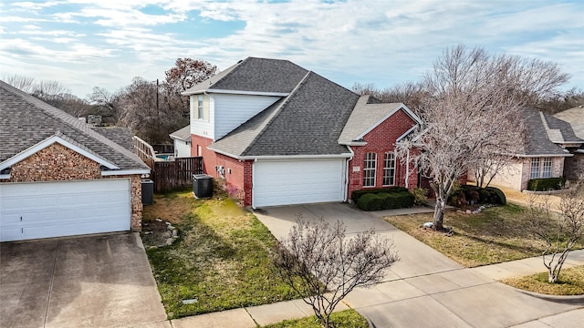 view of side of home with driveway, central air condition unit, brick siding, and roof with shingles