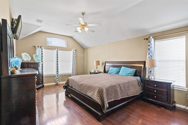 bedroom with vaulted ceiling, ceiling fan, baseboards, and hardwood / wood-style flooring