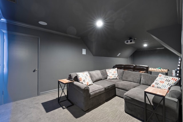 carpeted cinema with ornamental molding, recessed lighting, and vaulted ceiling