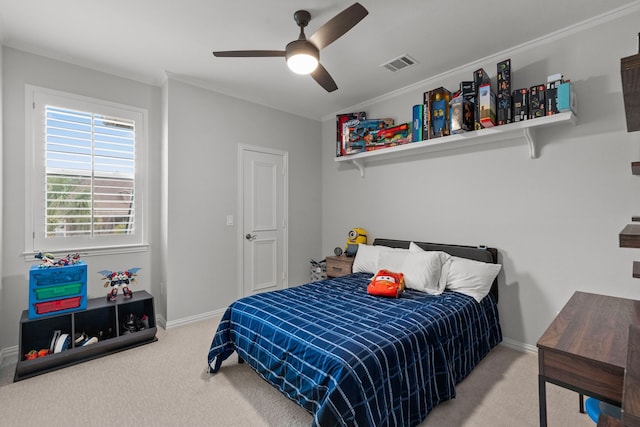 bedroom with baseboards, visible vents, crown molding, and carpet flooring