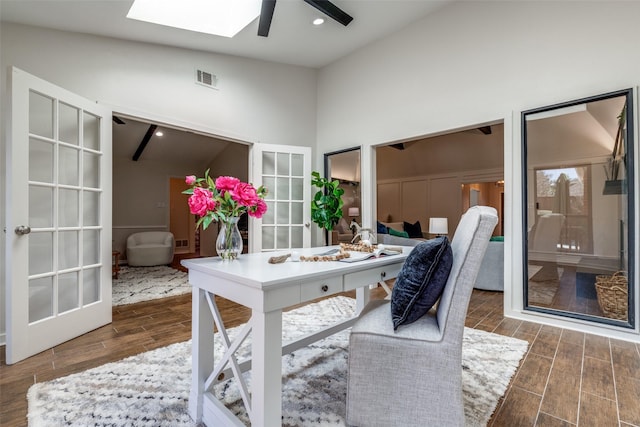 home office with ceiling fan, french doors, visible vents, and wood tiled floor