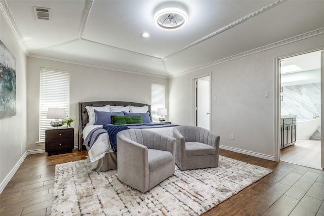 bedroom featuring ornamental molding, multiple windows, wood finished floors, and visible vents