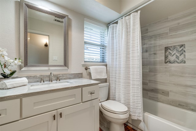 full bathroom featuring shower / bathtub combination with curtain, vanity, and toilet